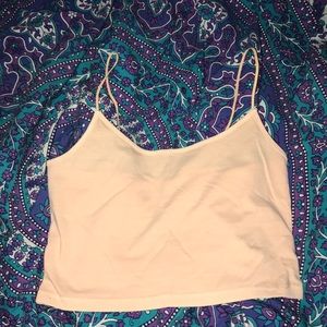 Cropped peach colored top, unworn, size small.